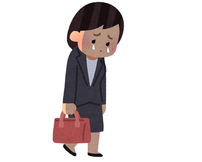 泣きそうな表情でスーツを着ている女性のイラスト
